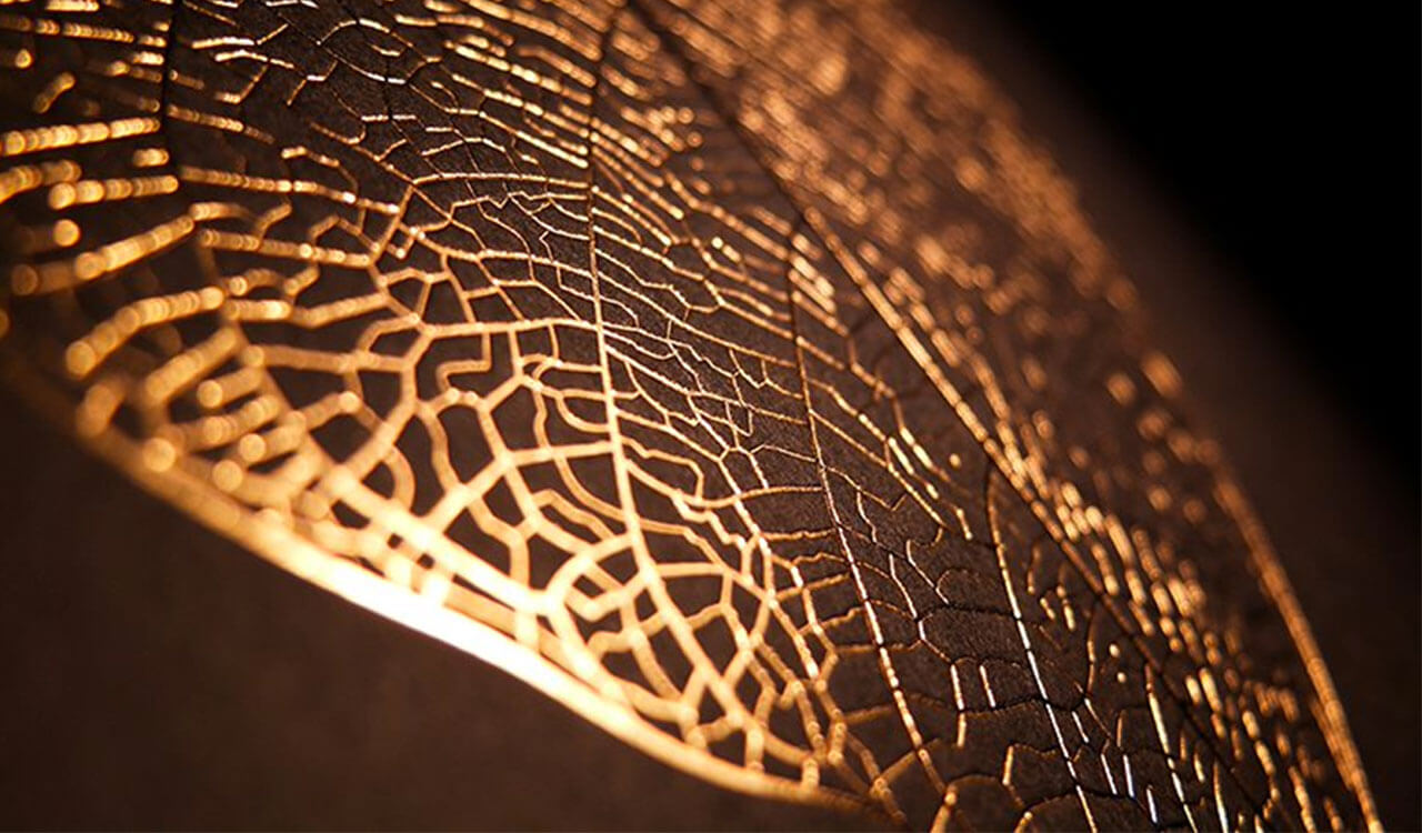 Hot foil stamping in gold with finest structures of a leaf